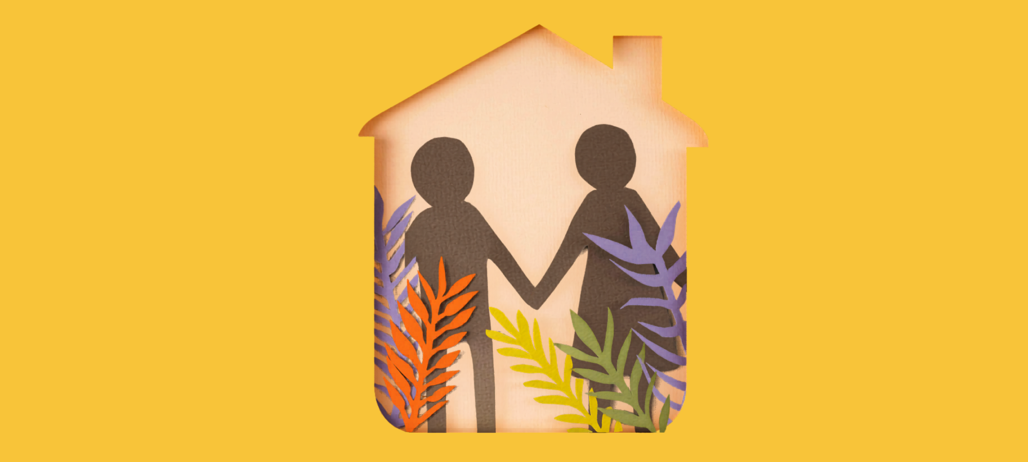 Deux personnes se tenant la main sous un même toit, illustrant le statut de cohabitant pour l'aide sociale en Belgique
